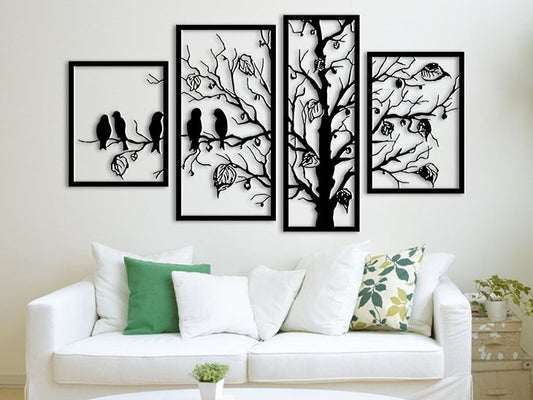 “4-panel tree and birds wall art mounted above a white sofa with green and floral cushions”