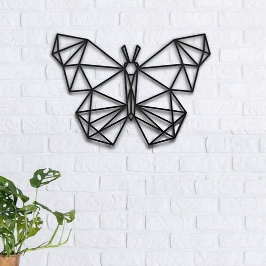 "Black geometric butterfly wall art made of MDF wood on a white brick wall – modern home decor"
