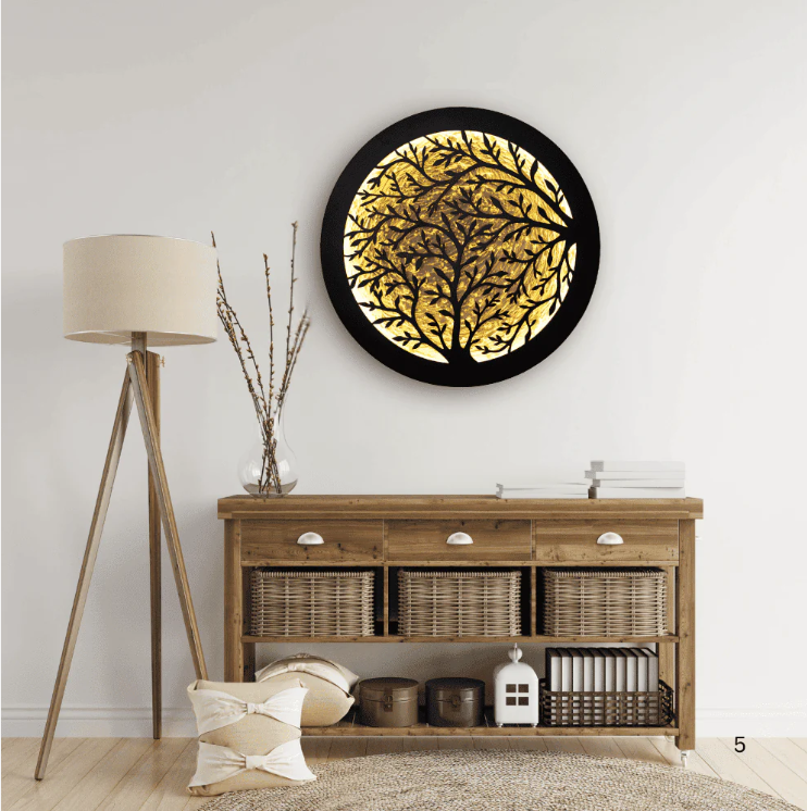 Round Tree of Life LED wall art with neon lighting, handmade wood texture, and laser-cut detailing, mounted above a wooden sideboard in a modern interior.