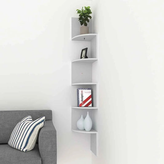 "Dark wooden zigzag corner wall shelf mounted beside a grey sofa, holding decor, books, and a plant."