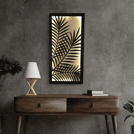 Decorative wall art with palm leaf design on a gray wall above a wooden console table.